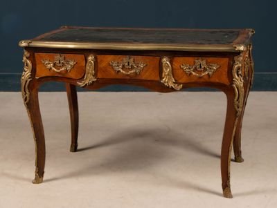 a small wooden table with a marble top on it