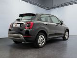the back end of a black fiat suv parked in a garage