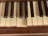 a close up view of a piano keyboard with many keys