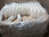 a large pile of plastic bottles sitting on top of a pallet