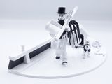 a toy figure of a man with a sword and a dog
