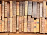 a box full of old books sitting on a table