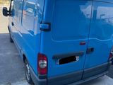 a picture of a blue van parked in a parking lot