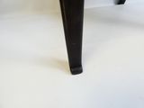 a close up of a black table with a wooden top