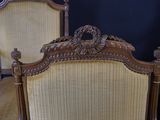 two chairs that are next to each other in a room