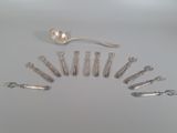 many forks and spoons arranged in the shape of a circle