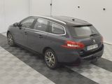 a picture of a grey car parked in a garage