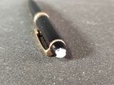 a pen that is laying on top of a table