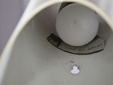 a close up view of a toilet with a light on it