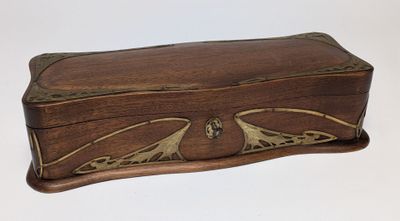 an image of a wooden box with a decorative design on it