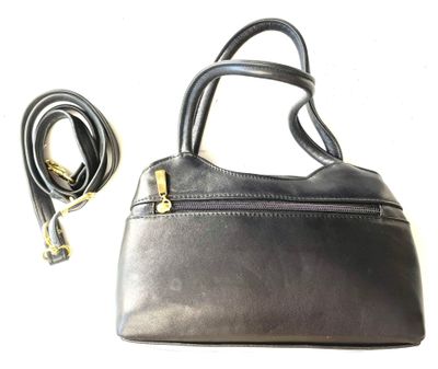 black leather purse with gold hardware and strap on a white background