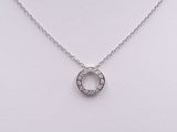 a white gold necklace with a diamond circle on a chain