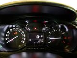 a close up of a car dashboard with a speedometer and gauges