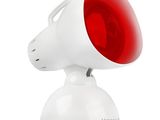 un gros plan sur une lumière rouge au sommet d'un objet blanc