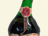 a bottle of wine that is sitting on a table