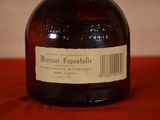 a bottle of liquor sitting on a table with a barcode on it