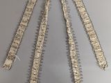 a close up of a metal chain on a gray surface