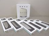several boxes of electronic devices sitting on a table next to each other