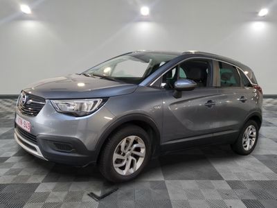 a grey suv parked in a garage with a checkered floor