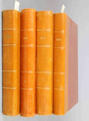 four orange books stacked on top of each other on a white surface