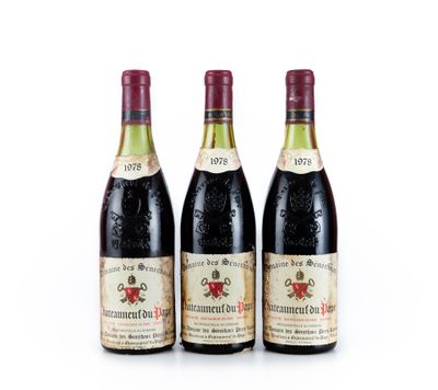 trois bouteilles de vin sont posées côte à côte sur une surface blanche