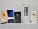 Plusieurs types de parfums sont disposés sur une surface blanche