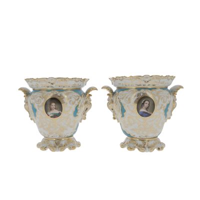 two vases with pictures of a man and a woman on them