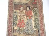 an image of a tapestry hanging on a wall with a painting of a man and a woman