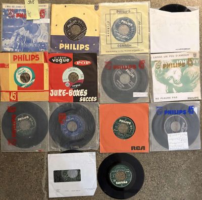 various records are arranged on the floor in a pile