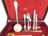 a red box with silverware in it and a pair of scissors