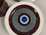 many plates that are sitting on a table