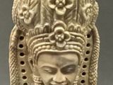 an image of a statue of a woman with a hat on her head