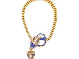 a close up of a necklace on a white background