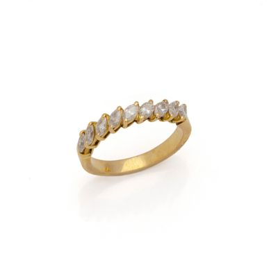 a yellow gold ring with five white diamonds