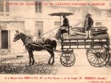 a black and white photo of a horse pulling a carriage