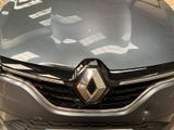 a close up of a car that is parked in a parking lot