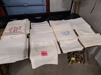 many towels that are on a table in a room