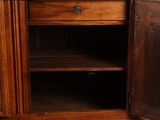 a wooden cabinet with a drawer and a door open