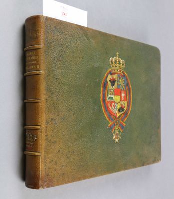 an old book with a picture of a coat of arms on it