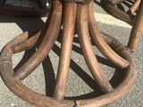 a wooden table with a glass top on the street