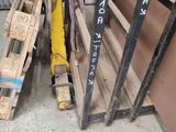 a pile of pallets sitting next to a wall