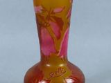 a glass vase with a floral design on it