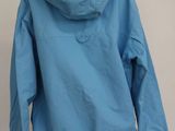 the back of a blue jacket on a mannequin stand