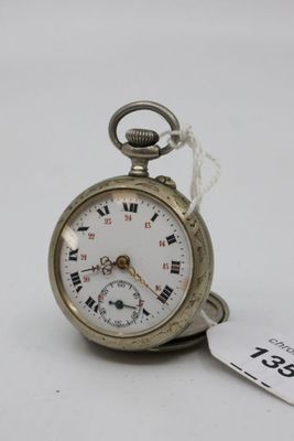 a silver pocket watch with roman numerals on it