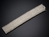 a diamond and white gold bracelet, by cartier