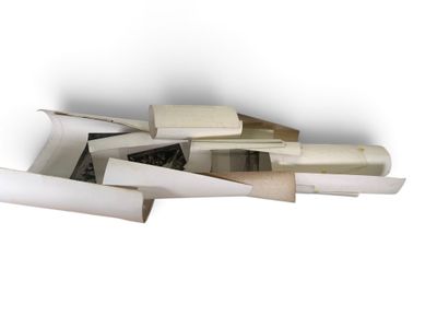 a pile of books and papers on a white surface