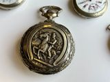 many different types of pocket watches displayed on a white surface
