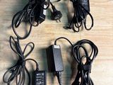 four different types of power cords and a charger on a table