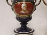 two vases that have pictures of men on them