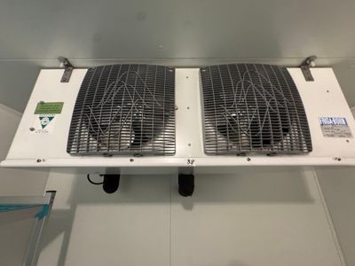 two fans that are attached to the wall